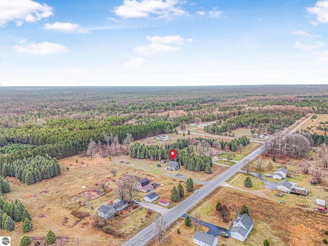5891 Voice Rd, Kingsley, MI 49649 - birds eye view of property featuring a wooded view