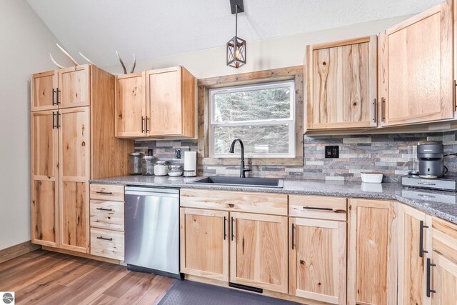 5891 Voice Rd, Kingsley, MI 49649 - kitchen with backsplash, dishwasher, light brown cabinets, and a sink
