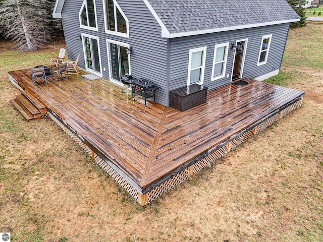 5891 Voice Rd, Kingsley, MI 49649 - wooden deck featuring an outdoor fire pit