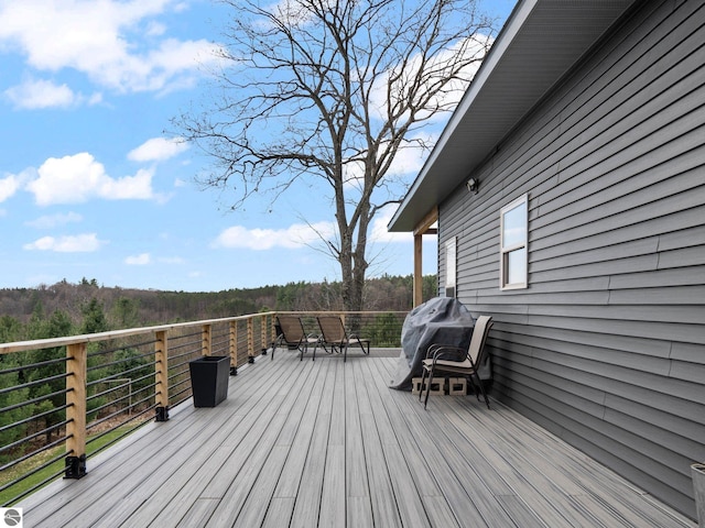 5242 W Big Sky Trl, Cadillac, MI 49601 - wooden deck with a grill
