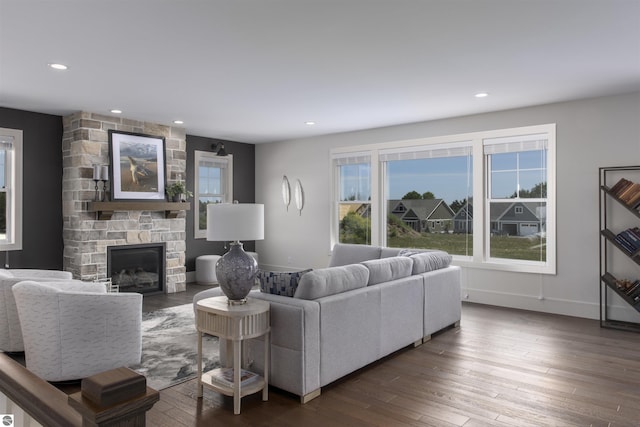 203 Vineyard Ridge Dr Unit 38, Traverse City, MI 49686 - living room featuring baseboards, hardwood / wood-style flooring, a stone fireplace, and recessed lighting