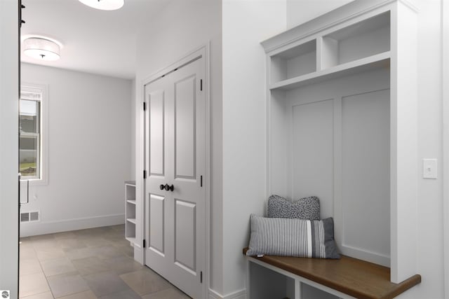 203 Vineyard Ridge Dr Unit 38, Traverse City, MI 49686 - mudroom with visible vents and baseboards