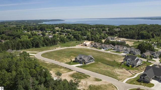 203 Vineyard Ridge Dr Unit 38, Traverse City, MI 49686 - aerial view featuring a residential view, a forest view, and a water view