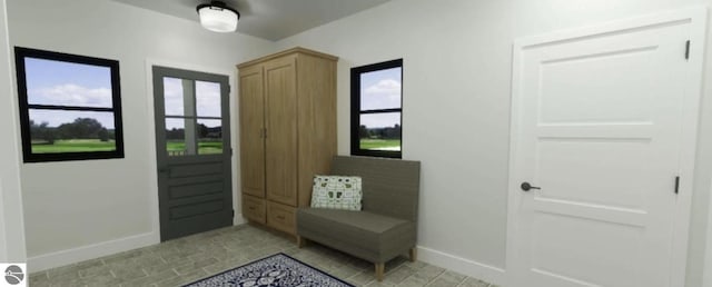 entryway featuring baseboards