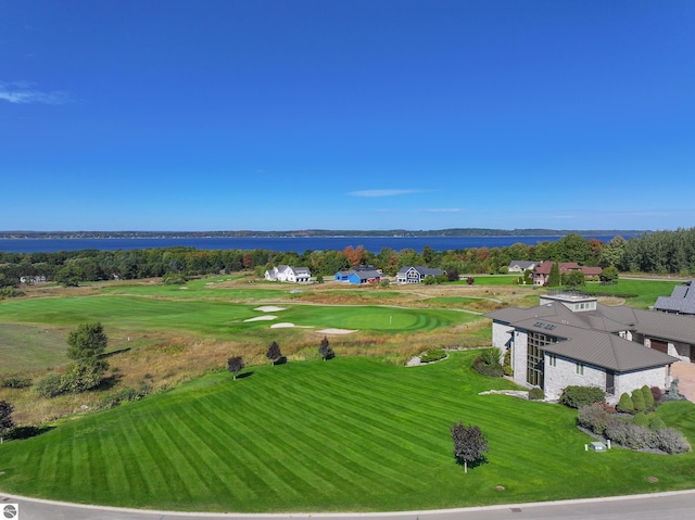 bird's eye view of a golf club and a nearby body of water