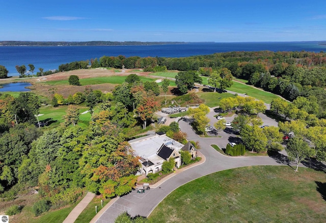 view of property location featuring a large body of water and a golf course