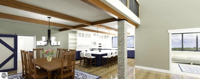 dining room featuring beam ceiling, light wood-style floors, decorative columns, a chandelier, and a barn door