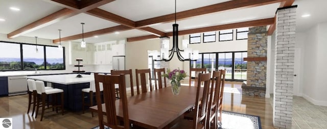 dining area featuring beamed ceiling, plenty of natural light, light wood-type flooring, a chandelier, and baseboards