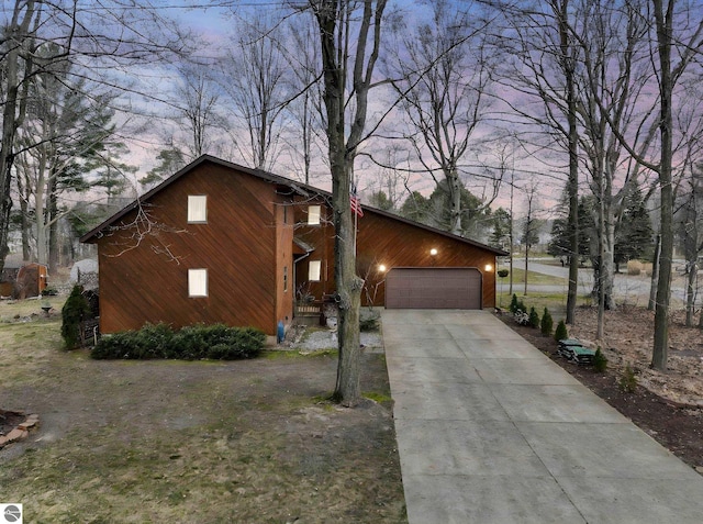 view of front of property with an attached garage and concrete driveway