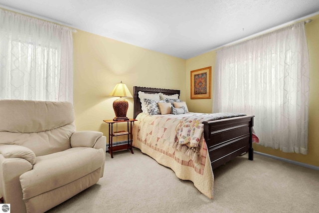 carpeted bedroom with baseboards