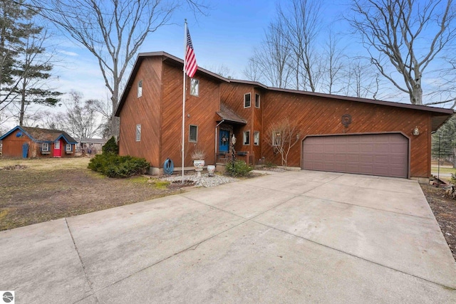 view of front facade featuring an attached garage and concrete driveway