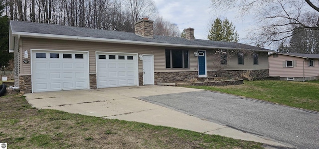 single story home with an attached garage, stone siding, a front yard, a chimney, and driveway