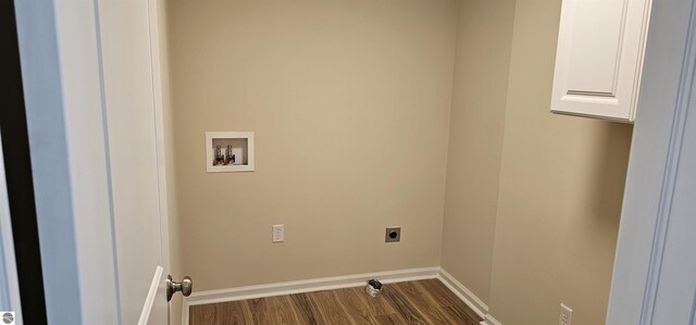 washroom featuring hookup for an electric dryer, baseboards, dark wood finished floors, and hookup for a washing machine