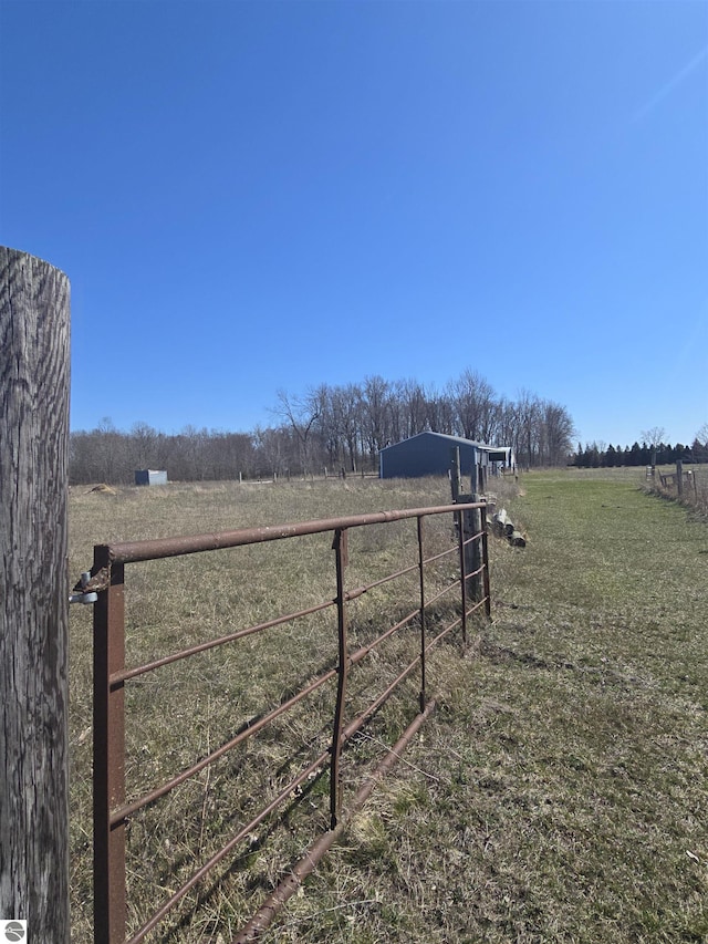 1215 S W County Line Rd, Sumner, MI 48889 - view of yard featuring a rural view and fence