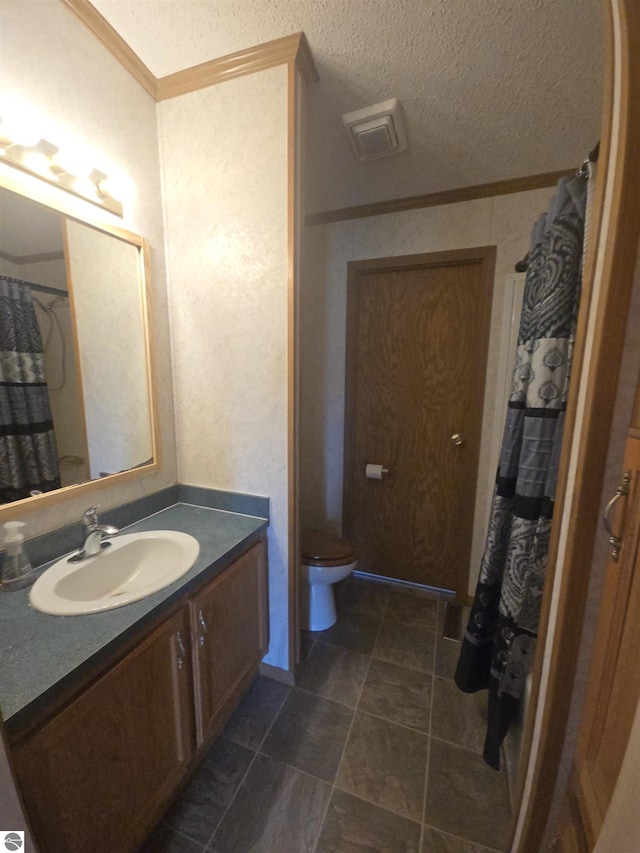 1215 S W County Line Rd, Sumner, MI 48889 - bathroom featuring toilet, crown molding, and vanity