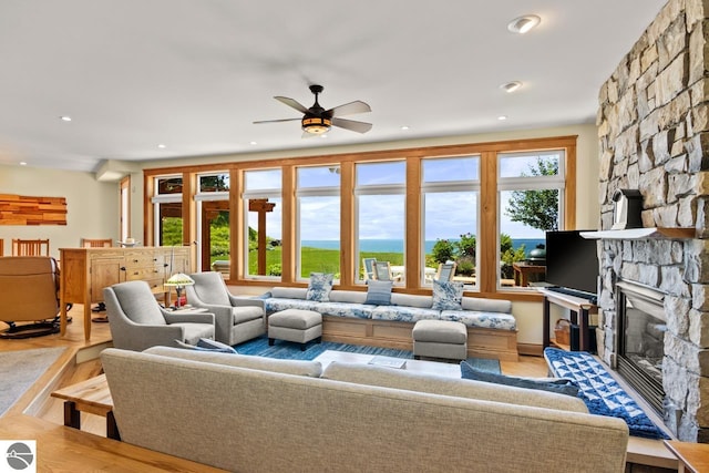 4201 N High Bluffs Dr, Leland, MI 49654 - living area with a fireplace, recessed lighting, a ceiling fan, and light wood-type flooring