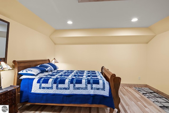 4201 N High Bluffs Dr, Leland, MI 49654 - bedroom with recessed lighting, wood finished floors, and baseboards
