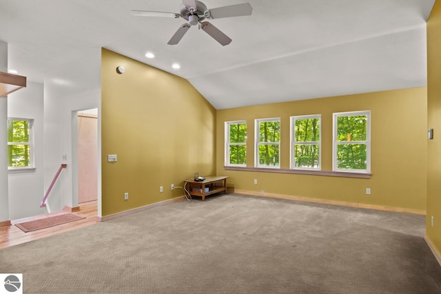 4201 N High Bluffs Dr, Leland, MI 49654 - unfurnished room with carpet flooring, ceiling fan, lofted ceiling, and baseboards