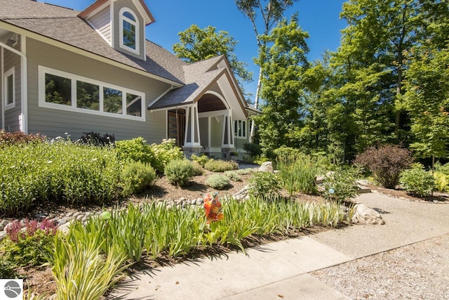 4201 N High Bluffs Dr, Leland, MI 49654 - view of property exterior with a shingled roof