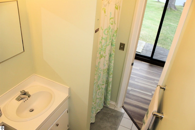 full bath with tile patterned floors, vanity, and a shower with curtain