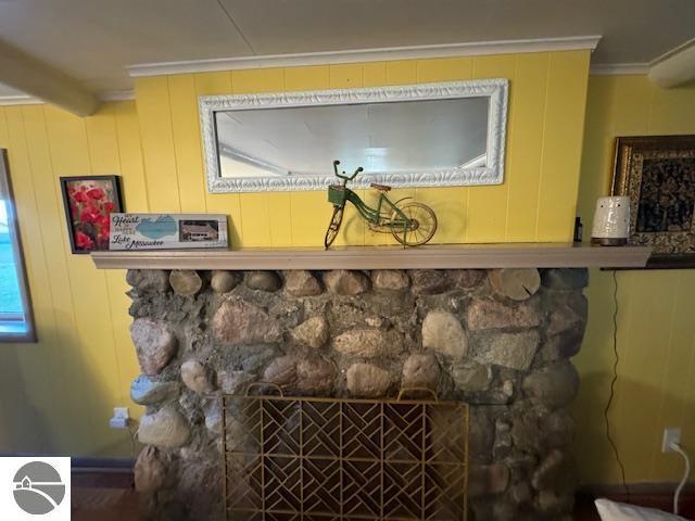 1900 Pavilion Dr, Lake City, MI 49651 - interior details with crown molding and a fireplace