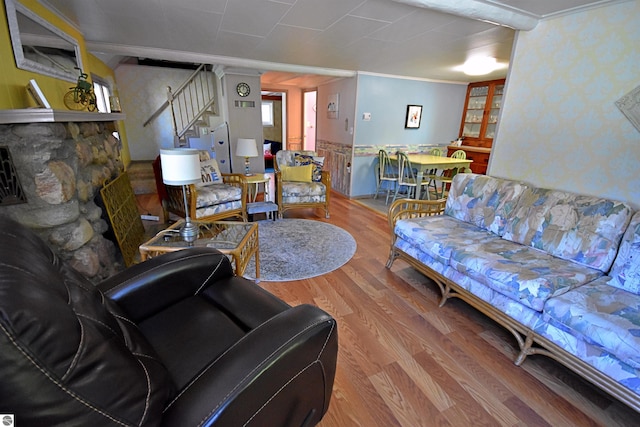 1900 Pavilion Dr, Lake City, MI 49651 - living room featuring stairway, wood finished floors, ornamental molding, and wallpapered walls