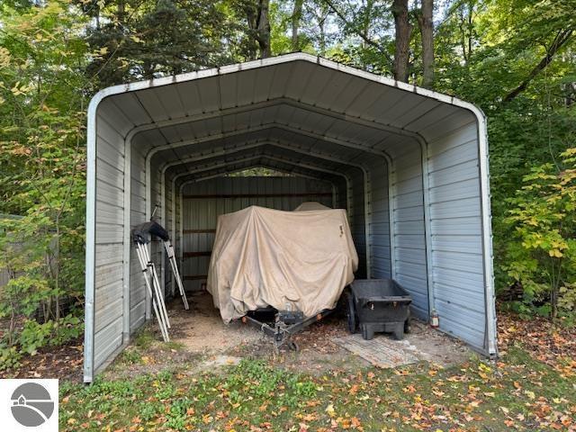 1900 Pavilion Dr, Lake City, MI 49651 - view of outbuilding featuring a carport
