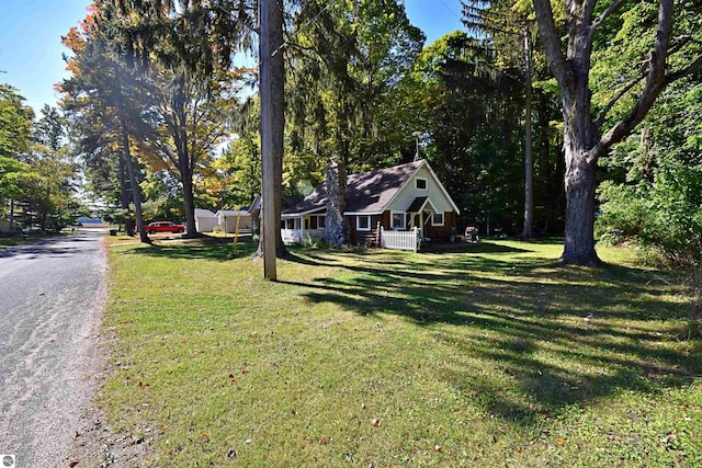 1900 Pavilion Dr, Lake City, MI 49651 - exterior space with a front lawn