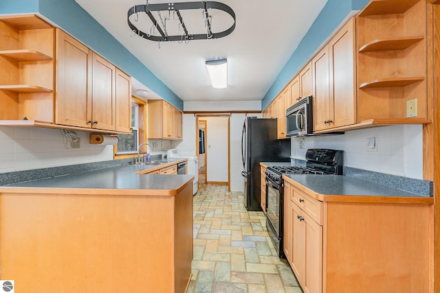 7888 E Broomfield Rd, Mount Pleasant, MI 48858 - kitchen with black range with gas cooktop, open shelves, backsplash, and stainless steel microwave