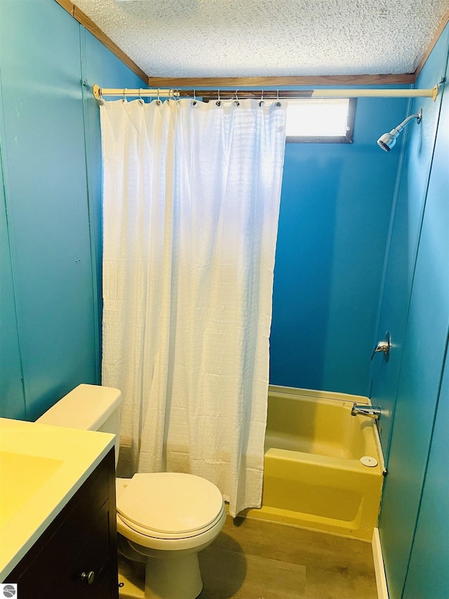 bathroom with a textured ceiling, wood finished floors, toilet, and shower / bath combo