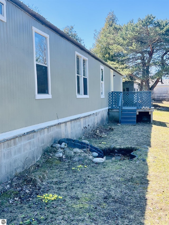 view of property exterior with a deck