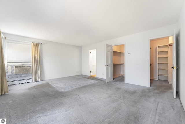 interior space featuring a baseboard radiator and carpet flooring