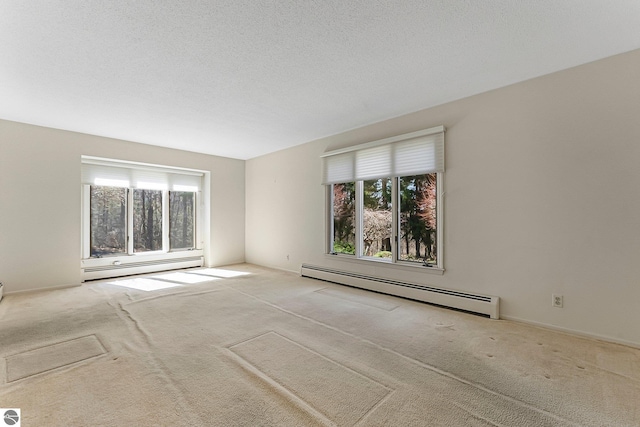 carpeted empty room with a baseboard radiator
