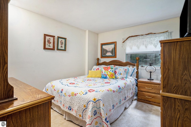 bedroom featuring light carpet
