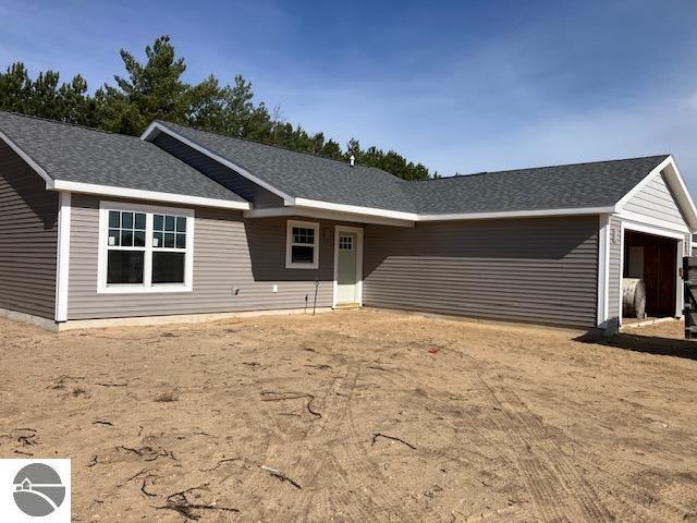 2740 Mockingbird Dr Unit 19, Traverse City, MI 49685 - view of single story home