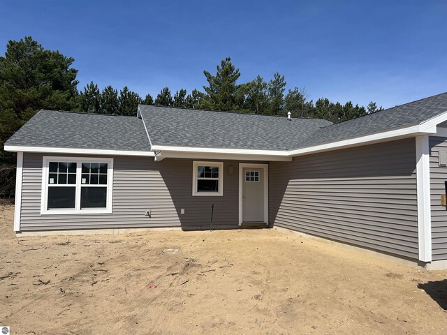 2740 Mockingbird Dr Unit 19, Traverse City, MI 49685 - ranch-style home featuring a shingled roof