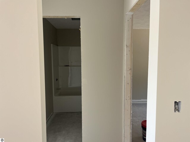 2740 Mockingbird Dr Unit 19, Traverse City, MI 49685 - corridor featuring concrete flooring