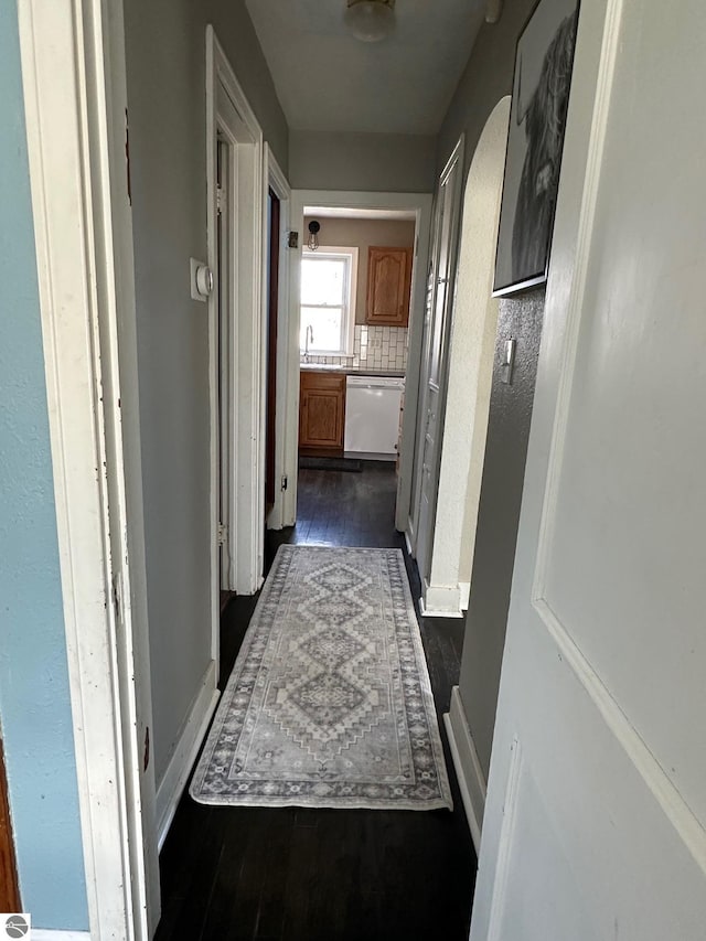 hall with dark wood finished floors