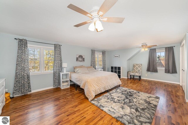 1016 Argyle Ct, Alma, MI 48801 - bedroom featuring wood finished floors, baseboards, a ceiling fan, and multiple windows