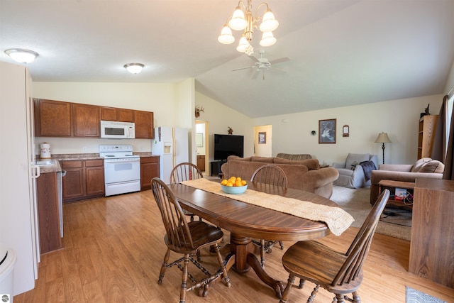 3193 Crimson Ranch Ln, Traverse City, MI 49685 - dining area featuring light wood finished floors, a ceiling fan, and lofted ceiling