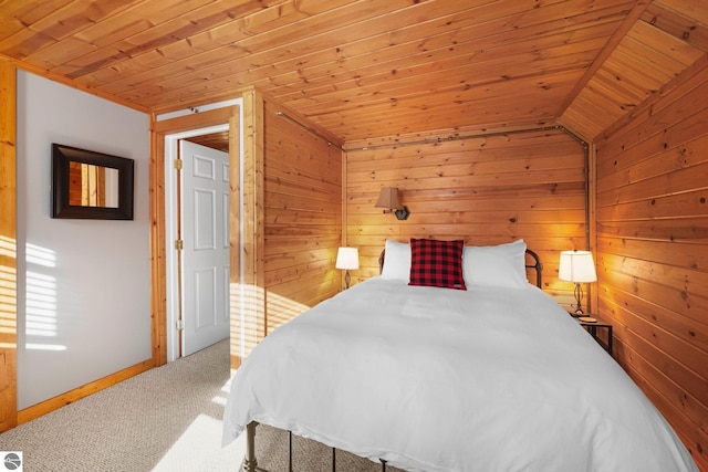 6836 NW Aarwood Trl, Rapid City, MI 49676 - bedroom featuring carpet floors, wood walls, wood ceiling, and baseboards