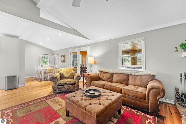 6836 NW Aarwood Trl, Rapid City, MI 49676 - living room with recessed lighting, vaulted ceiling with beams, and wood finished floors