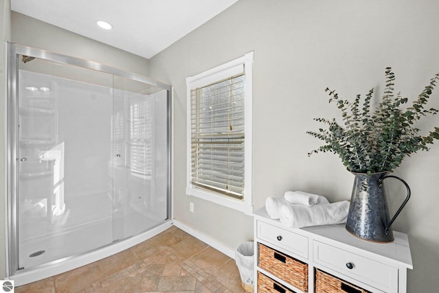 6836 NW Aarwood Trl, Rapid City, MI 49676 - full bath featuring baseboards and a stall shower
