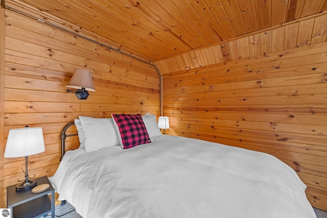 6836 NW Aarwood Trl, Rapid City, MI 49676 - bedroom featuring wood walls and wood ceiling