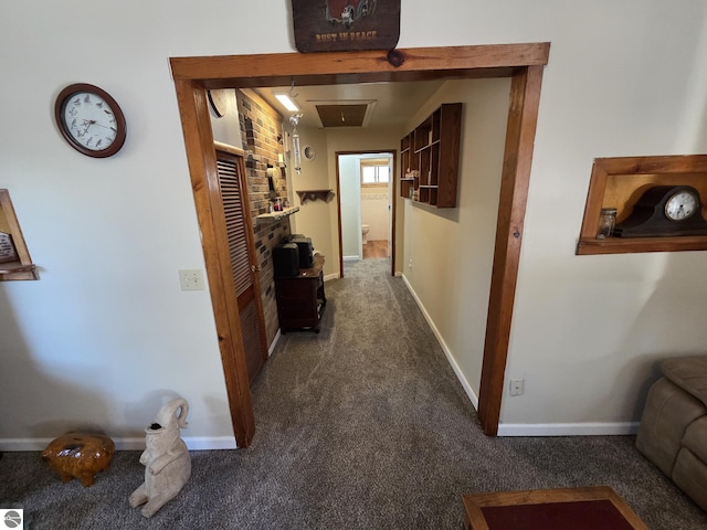 4280 Birch St, Lake, MI 48632 - hallway featuring dark colored carpet, baseboards, and attic access