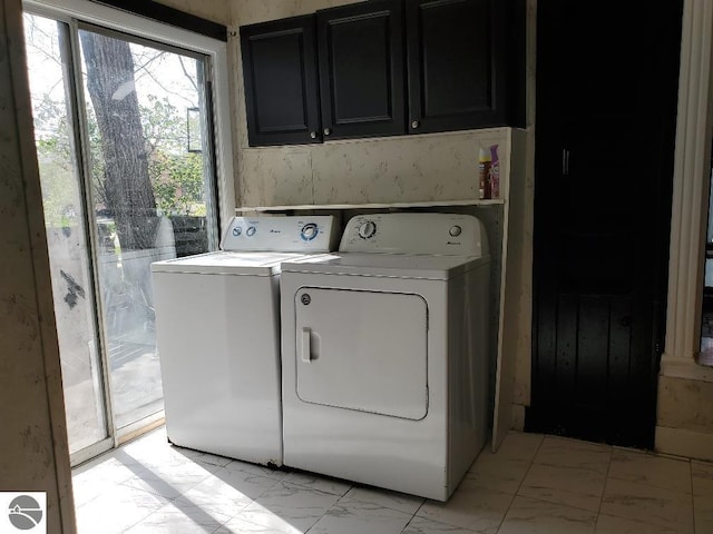 429 S Arnold, Mount Pleasant, MI 48858 - laundry room with marble finish floor, cabinet space, and washing machine and dryer
