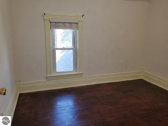 429 S Arnold, Mount Pleasant, MI 48858 - unfurnished room featuring baseboards and hardwood / wood-style floors