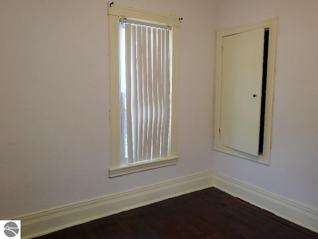 429 S Arnold, Mount Pleasant, MI 48858 - spare room featuring dark wood-style flooring and plenty of natural light