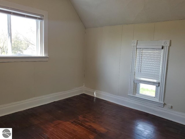 429 S Arnold, Mount Pleasant, MI 48858 - bonus room with dark wood-style flooring, baseboards, and lofted ceiling