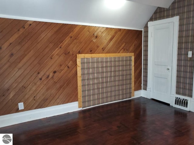 429 S Arnold, Mount Pleasant, MI 48858 - unfurnished room with wood finished floors, lofted ceiling, and wooden walls
